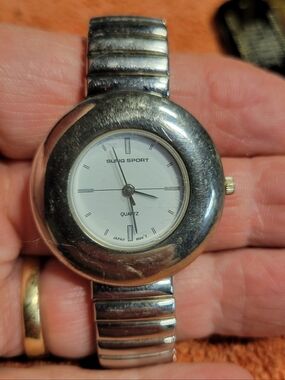 Men's large dial silver tone watch with expandable band